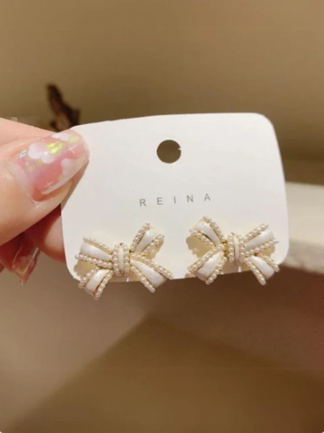 WHITE BOW STUD EARRINGS