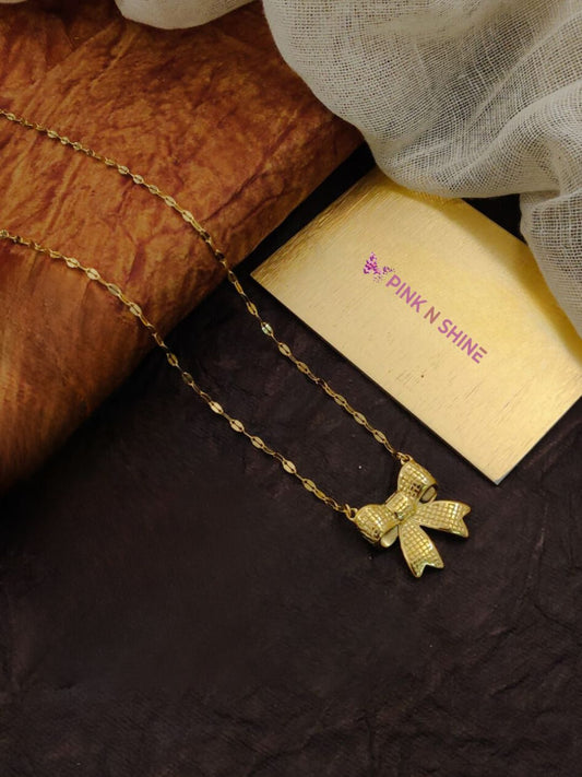 SOPHISTICATED BOW PENDANT